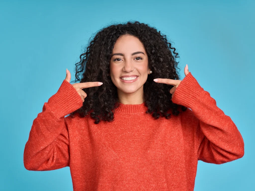 Young woman smiling with white teeth