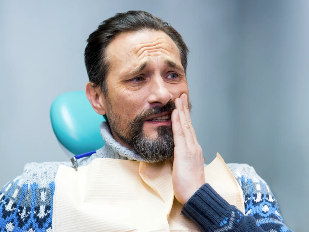 Man with toothache needing an emergency dentist in Chester Springs, PA
